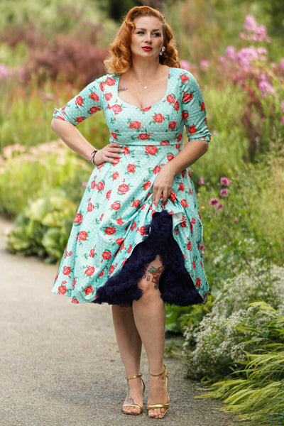 A model wearing a Rose Baby Blue Midi Dress