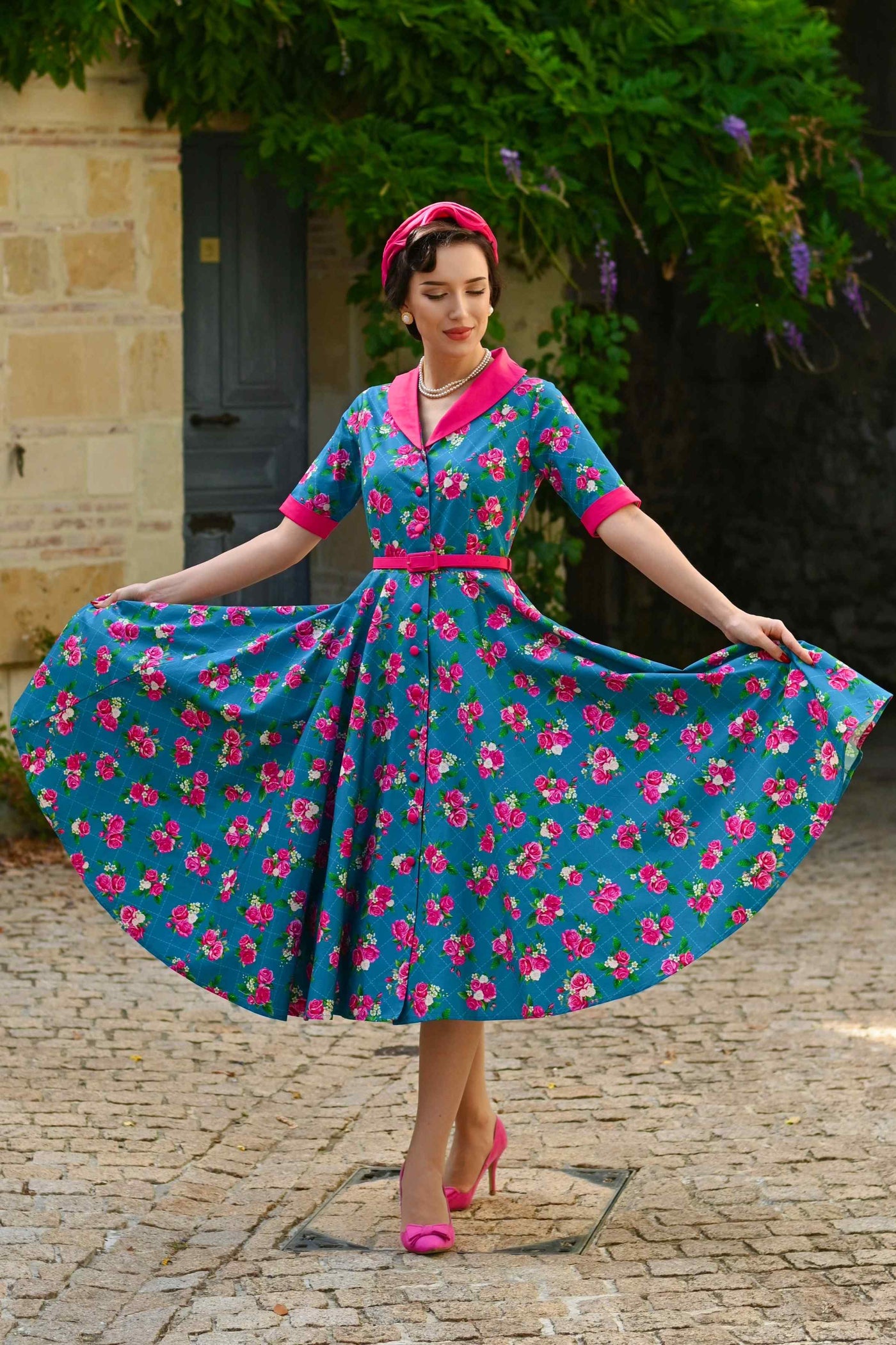 A lovely model wearing a Mollie Rose Full Circle Shirt Dress In Blue