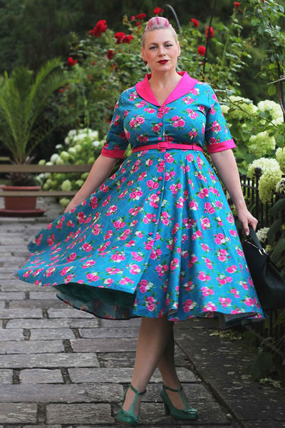 A woman wearing a Mollie Rose Full Circle Shirt Dress In Blue