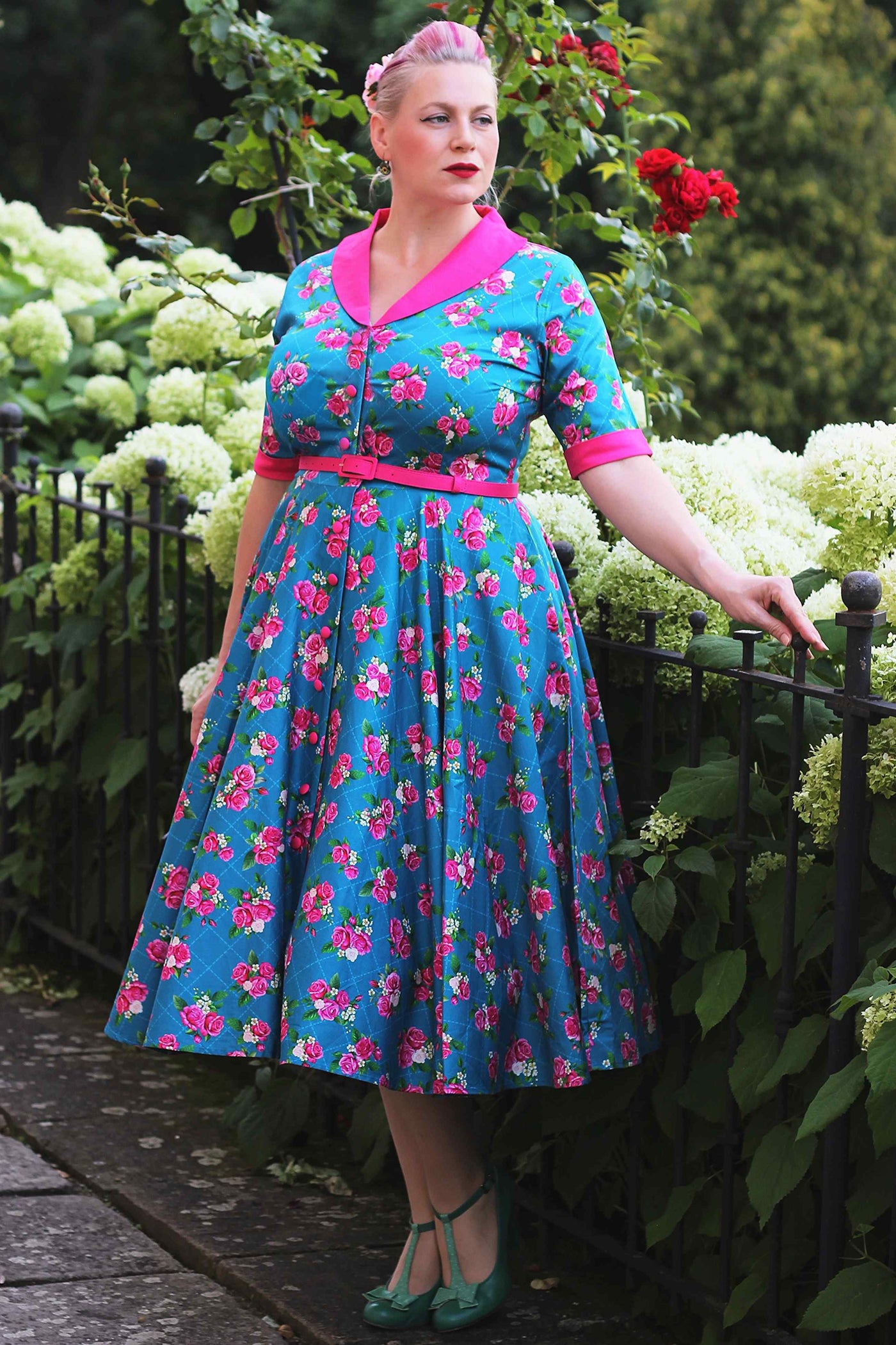 A lady wearing a Mollie Rose Full Circle Shirt Dress In Blue