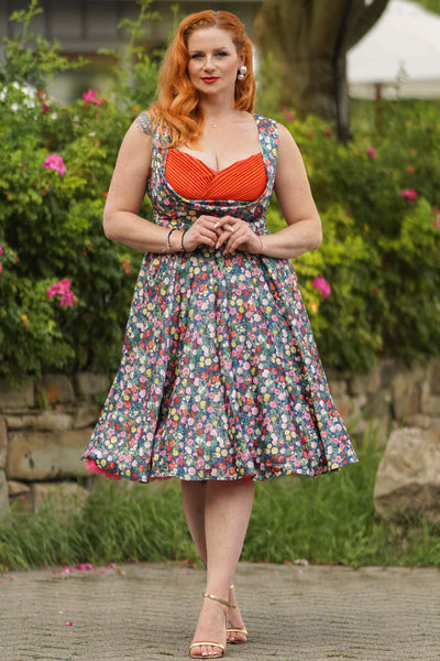 A model wearing a Rose Navy Blue Pleated Bust Dress