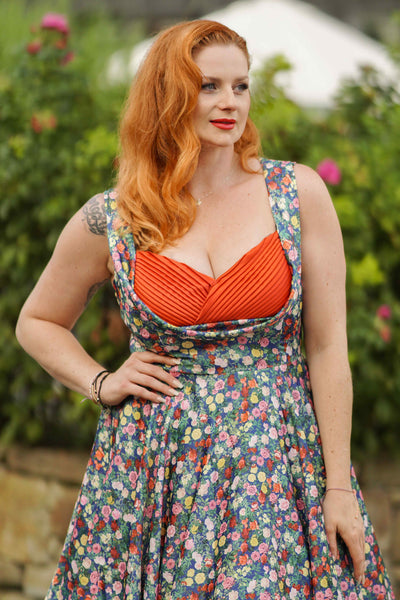 A model wearing a Rose Navy Blue Pleated Bust Dress