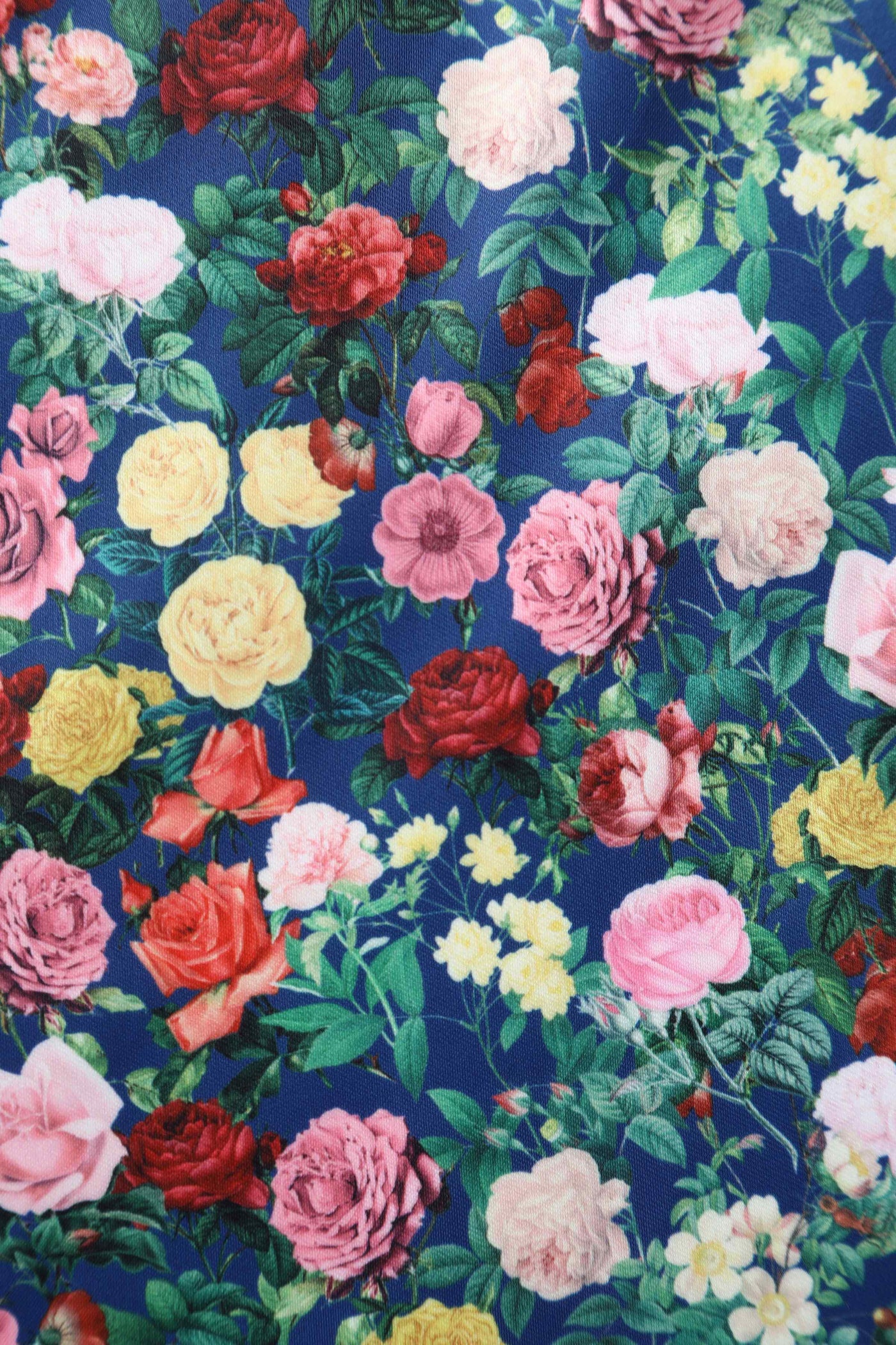 Close up view of Rose Print Pleated Bust Dress in Navy Blue