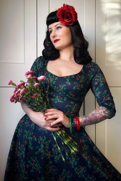 A model wearing a Rosebud Midi Dress On Navy Blue