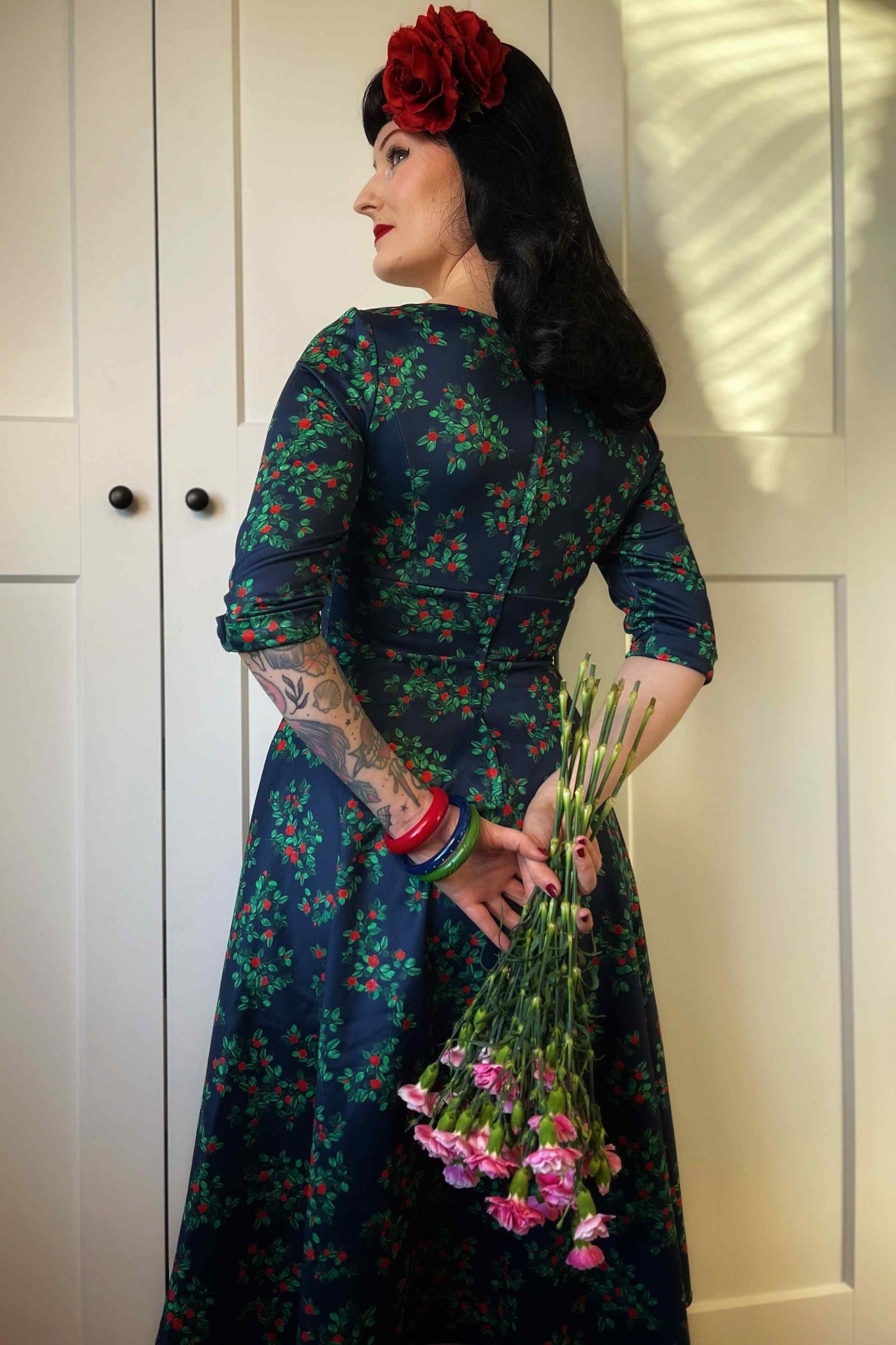 A model wearing a Rosebud Midi Dress On Navy Blue