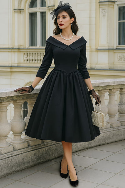 A model wearing a Ruth Black Retro Long Sleeved Dress