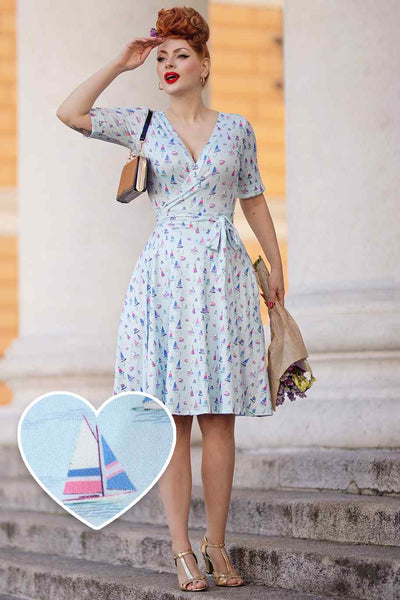 Model photo wearing a Sailboat Blue Wrap Dress