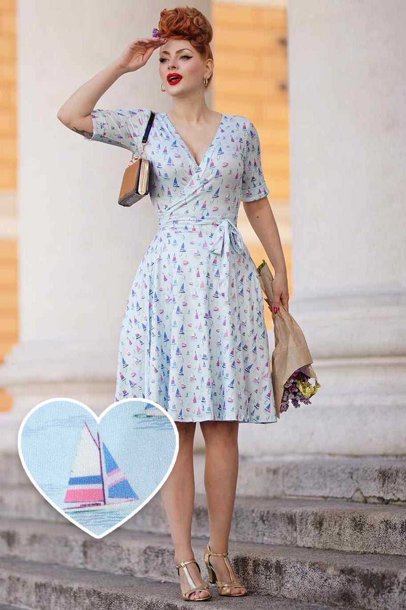 Model photo wearing a Sailboat Blue Wrap Dress