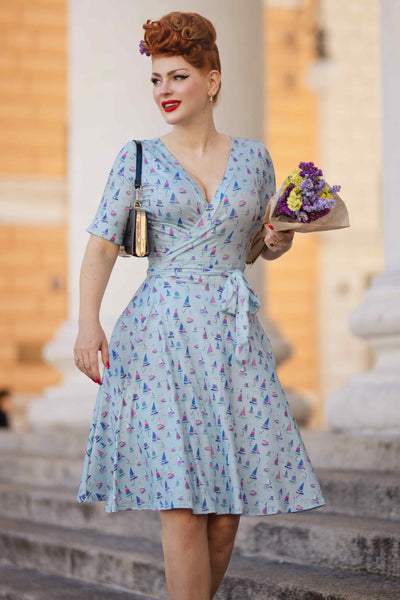 Model photo wearing a Sailboat Blue Wrap Dress