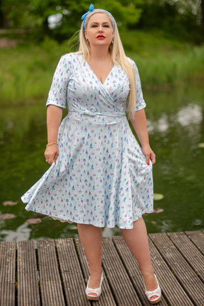 Model photo wearing a Sailboat Blue Wrap Dress