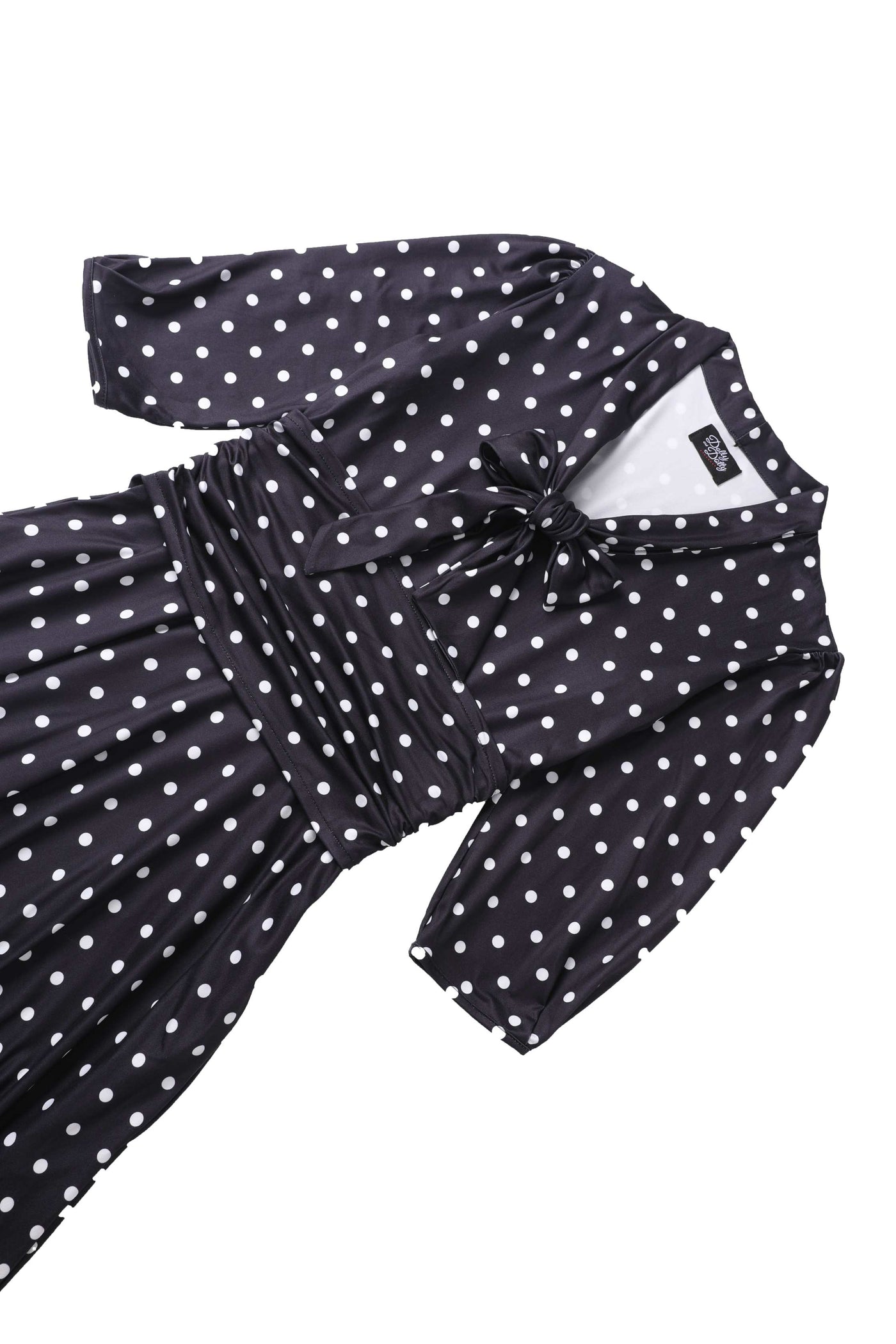 Close up view of Sandra Bow Tie Casual Dress In Black Polka Dots