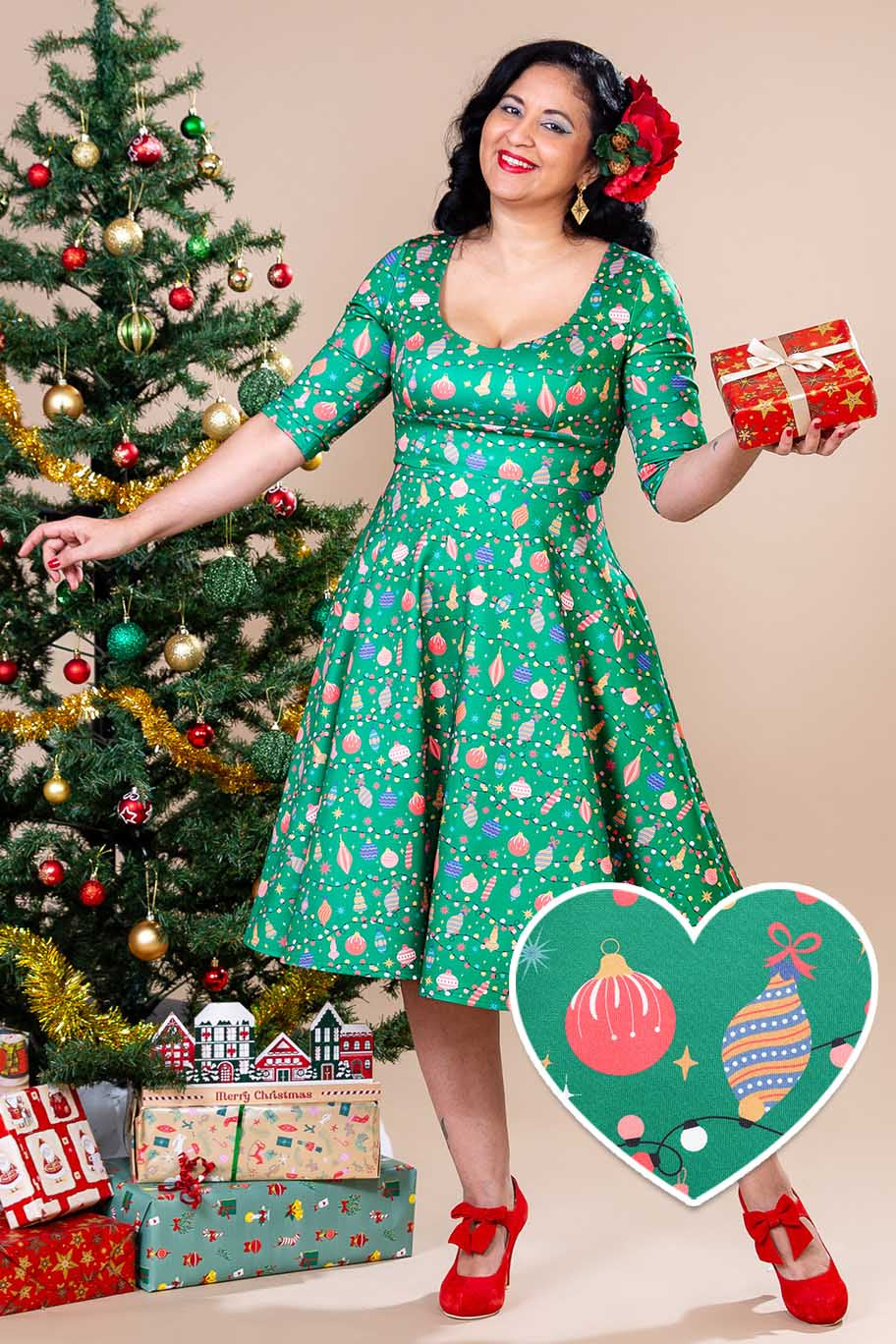A lady wearing a Scarlette Christmas Tree Green Midi Dress