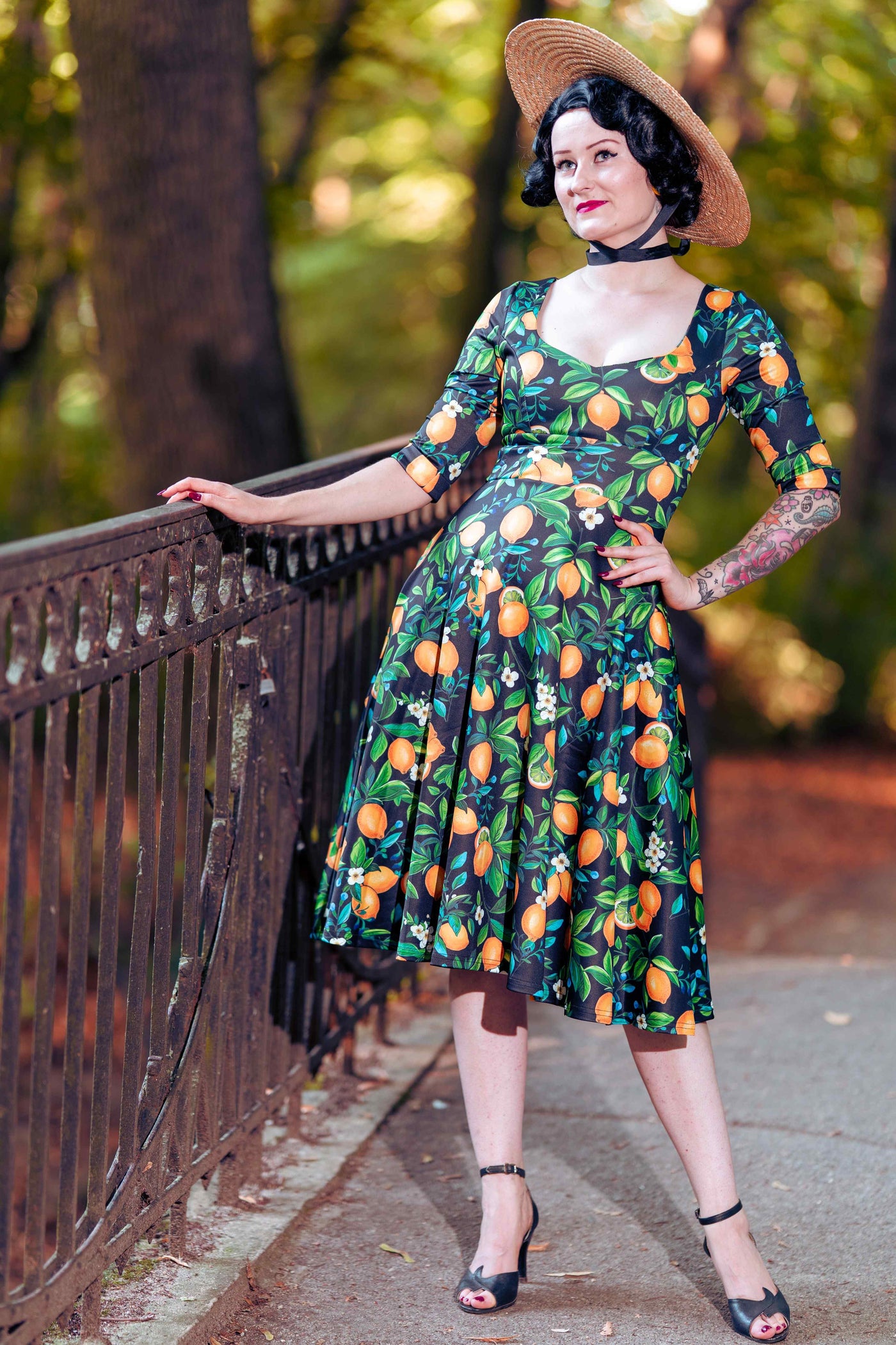 A model wearing a Scarlette Lemon Midi Dress In Dark Blue