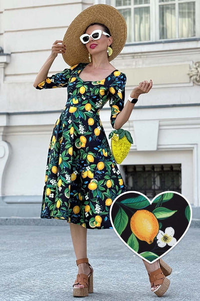 A model wearing a Scarlette Lemon Midi Dress In Dark Blue