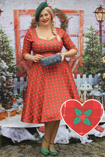 A model wearing a Scarlette Mistletoe Plaid Midi Dress