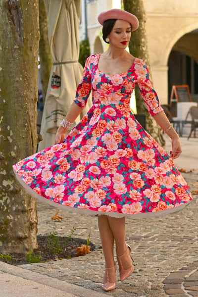 A model wearing a Scarlette Pink Magnolia Midi Dress