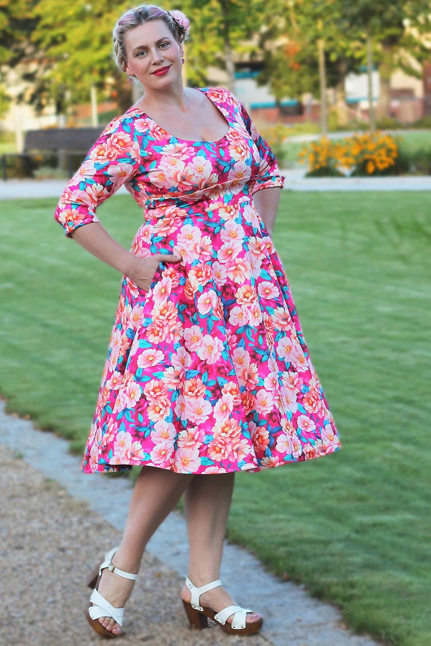 A model wearing a Scarlette Pink Magnolia Midi Dress