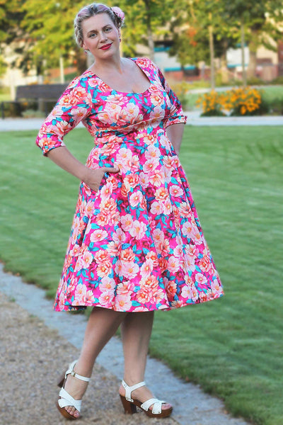 A model wearing a Scarlette Pink Magnolia Midi Dress