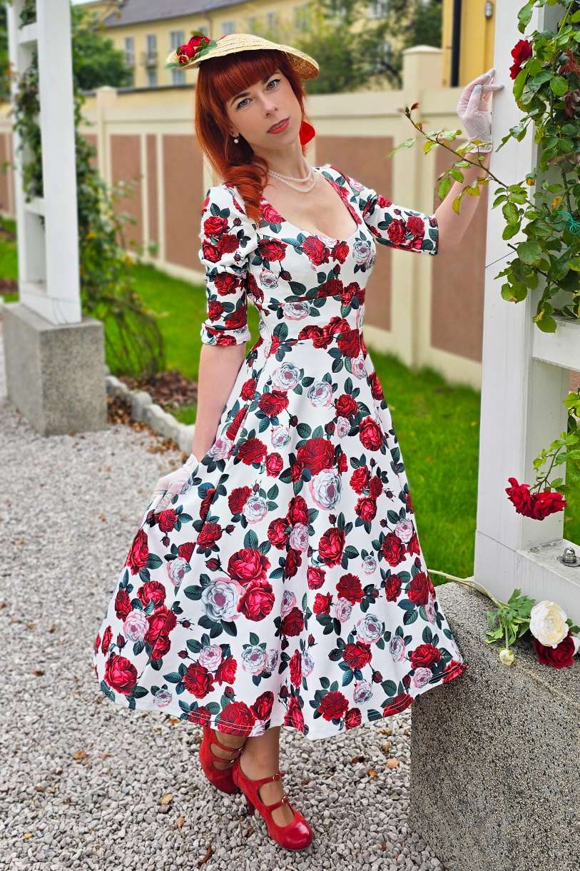 A model wearing a Scarlette Red Peony Midi Dress In White