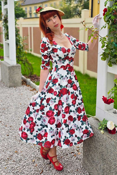A model wearing a Scarlette Red Peony Midi Dress In White