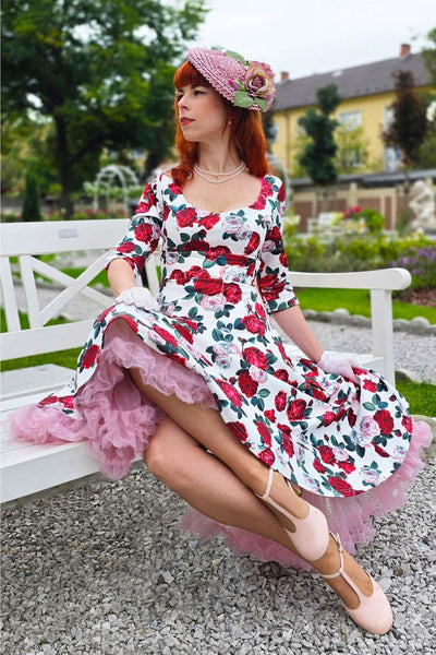 A woman wearing a Scarlette Red Peony Midi Dress In White