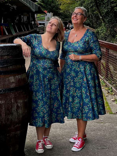 Ladies wearing the Scarlette Rosebud Midi Dress On Navy Blue
