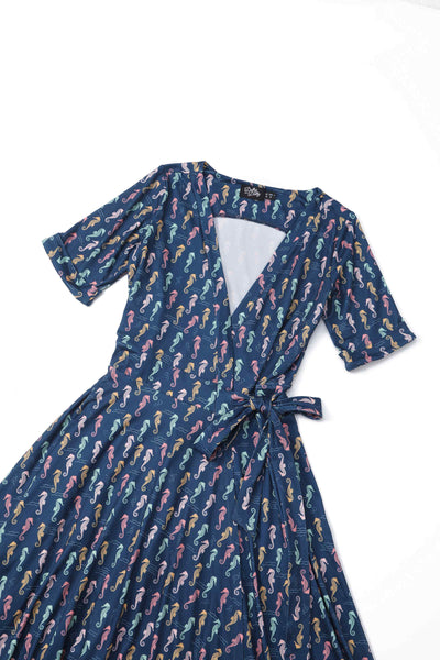 Close up view of Navy Blue Seahorse Wrap Dress