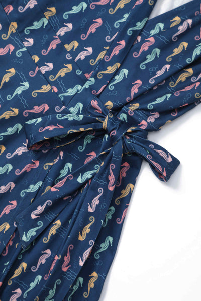 Close up view of Navy Blue Seahorse Wrap Dress