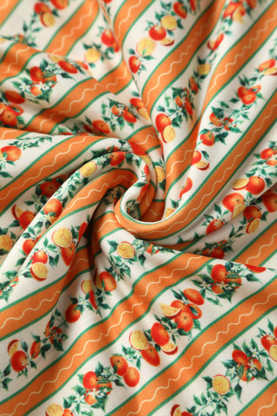 Close up view of Sicilian Orange Midi Dress