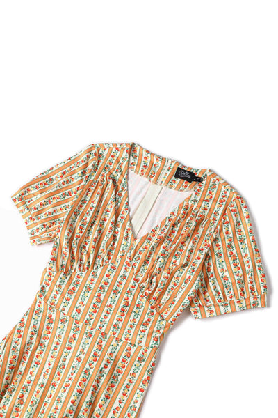 Close up view of Sicilian Orange Midi Dress