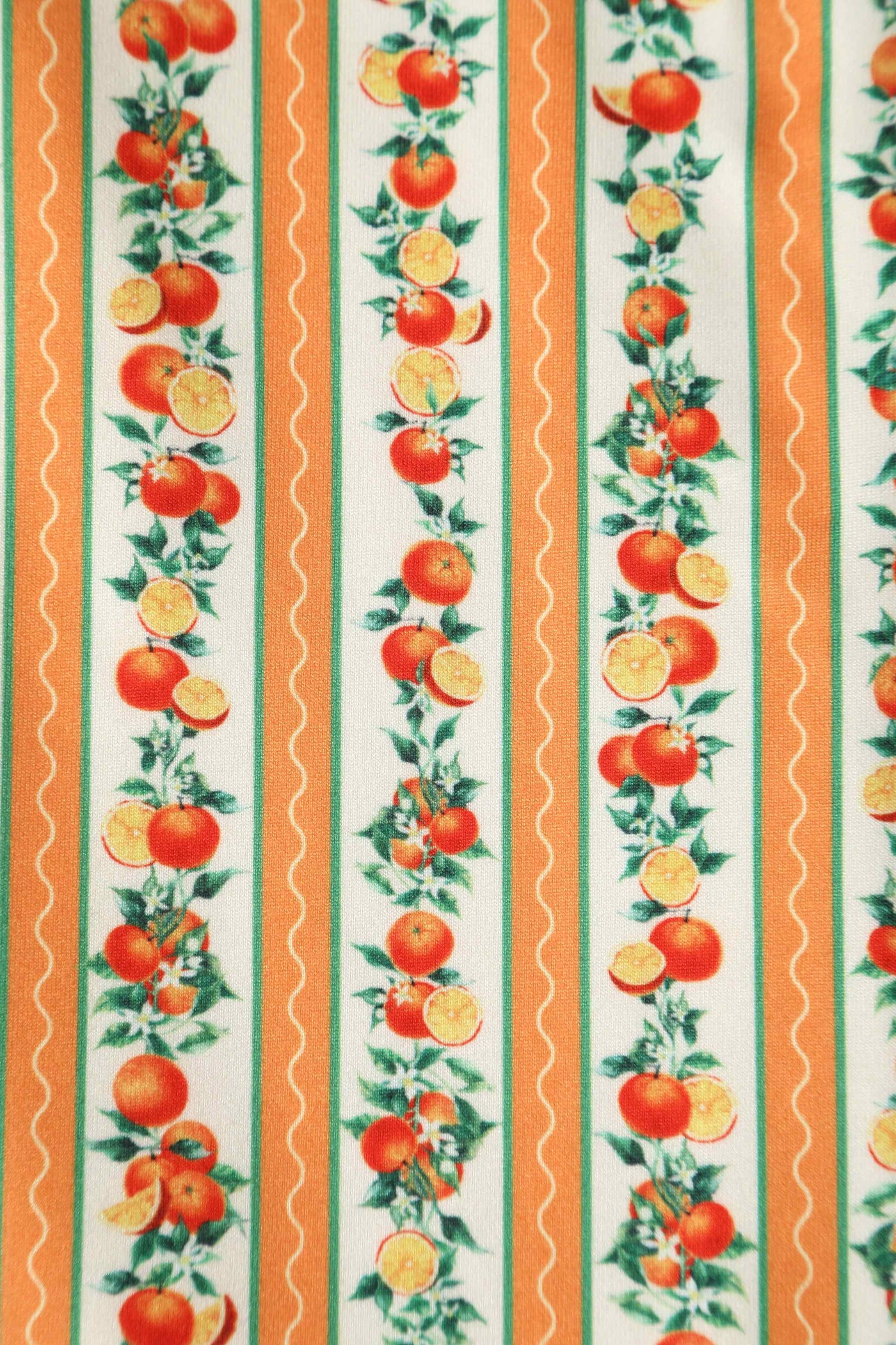 Close up view of Sicilian Orange Midi Dress