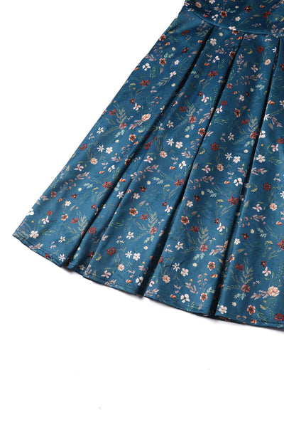 Close up view of Teal Ditsy Floral Off Shoulder Dress