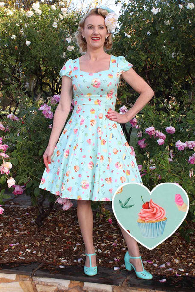A model wearing Sleeved Dress In Pastel Tea Cake Print