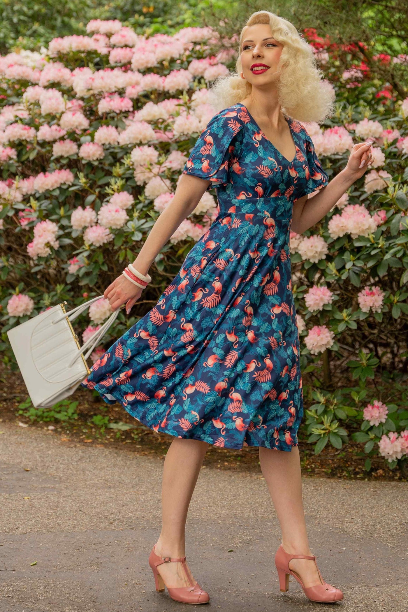 Model photo of Sleeved Tea Dress In Blue Flamingo & Leaves Print