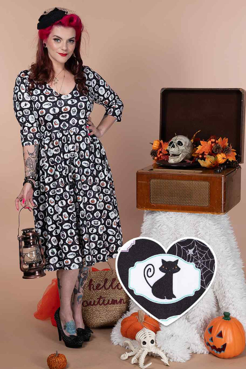 A model wearing Spooky Witchcraft Long Sleeved Dress