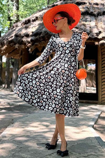 A lady wearing a Billie Spooky Witchcraft Long Sleeved Dress