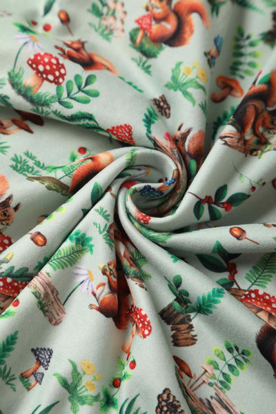 Close up view of Squirrel Woodland Print Tea Dress in Green