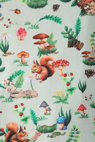 Close up view of Squirrel Woodland Print Tea Dress in Green