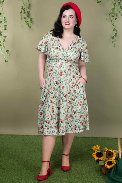 A model wearing a Green Squirrel Woodland Tea Dress