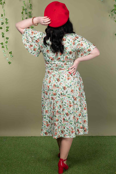 A model wearing a Green Squirrel Woodland Tea Dress