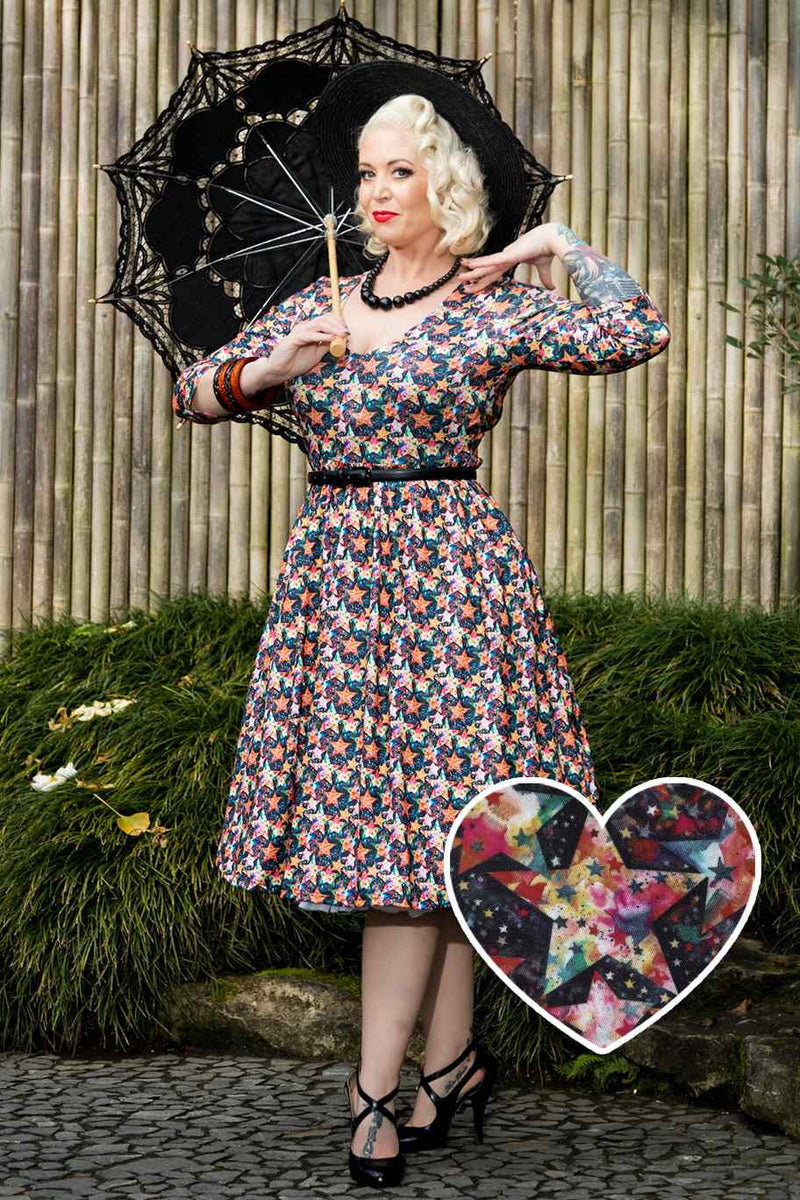 A model wearing a Starry Long Sleeved Dress