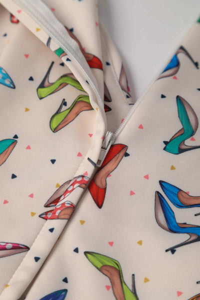 Close up view of Stiletto Print Off Shoulder Dress in Cream