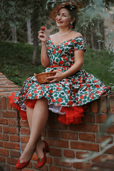 A lady wearing a Lily Strawberry Farm Off Shoulder Dress