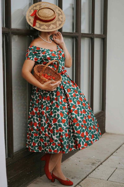 A model wearing a Lily Strawberry Farm Off Shoulder Dress