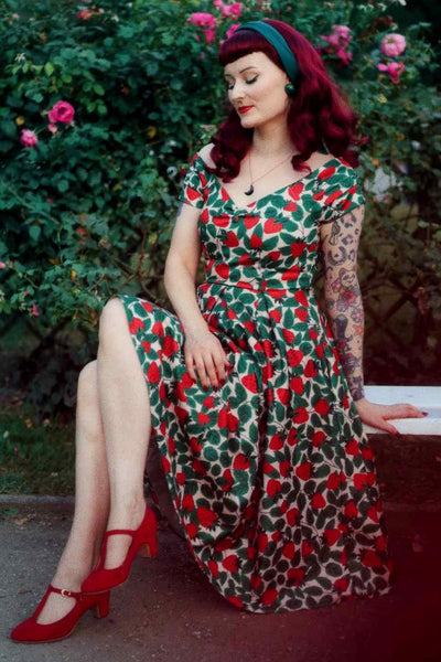 A model wearing a Lily Strawberry Farm Off Shoulder Dress