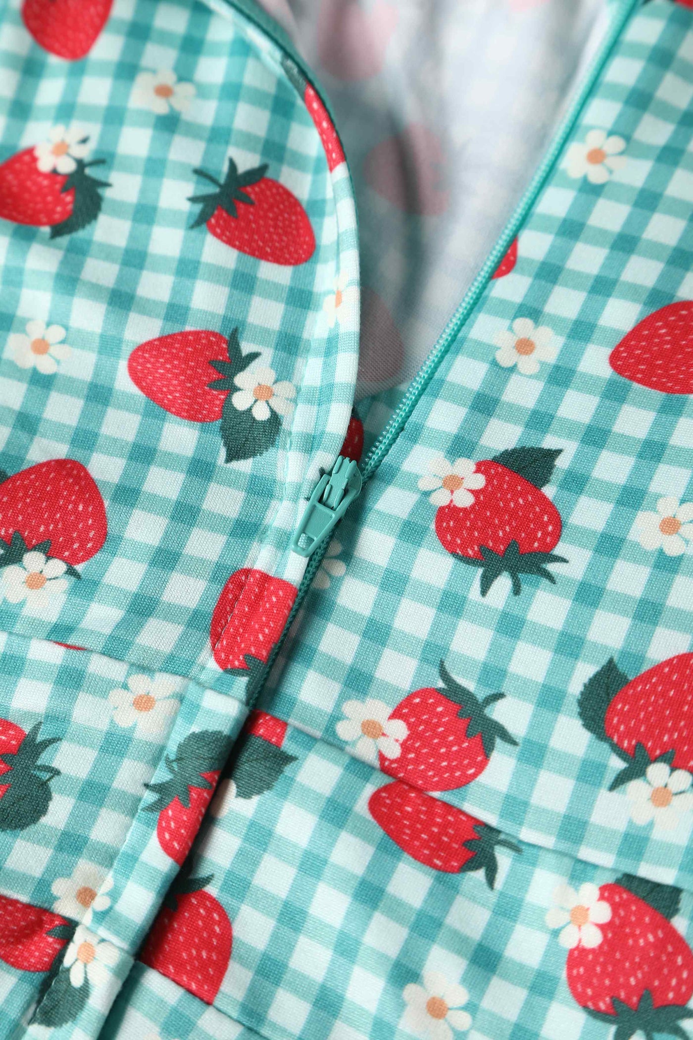 Close up view of Strawberry Midi Dress In Blue Gingham