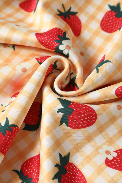 Close up view of Strawberry Yellow Gingham Flared Dress