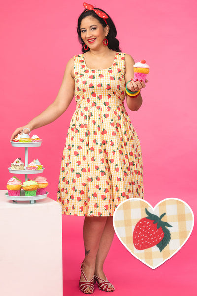 A model wearing a Strawberry Yellow Gingham Flared Dress