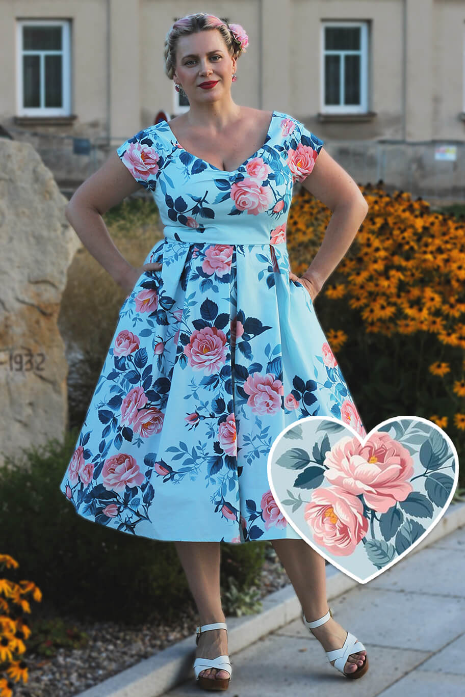 A model wearing a Lily Summer Rose Off Shoulder Dress In Light Blue