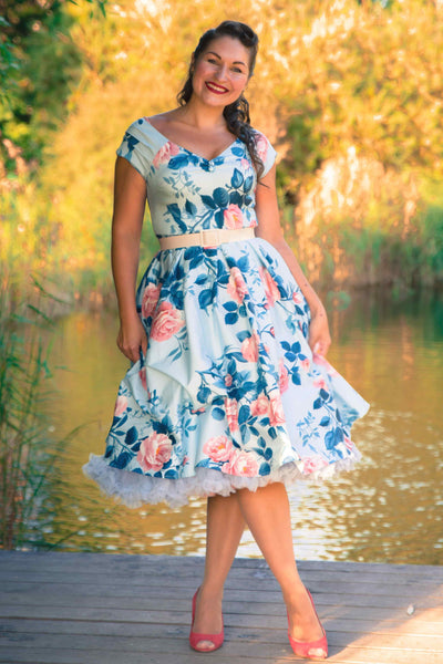 A model wearing a Summer Rose Off Shoulder Dress In Light Blue
